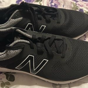Black New Balance sneakers . Never worn.